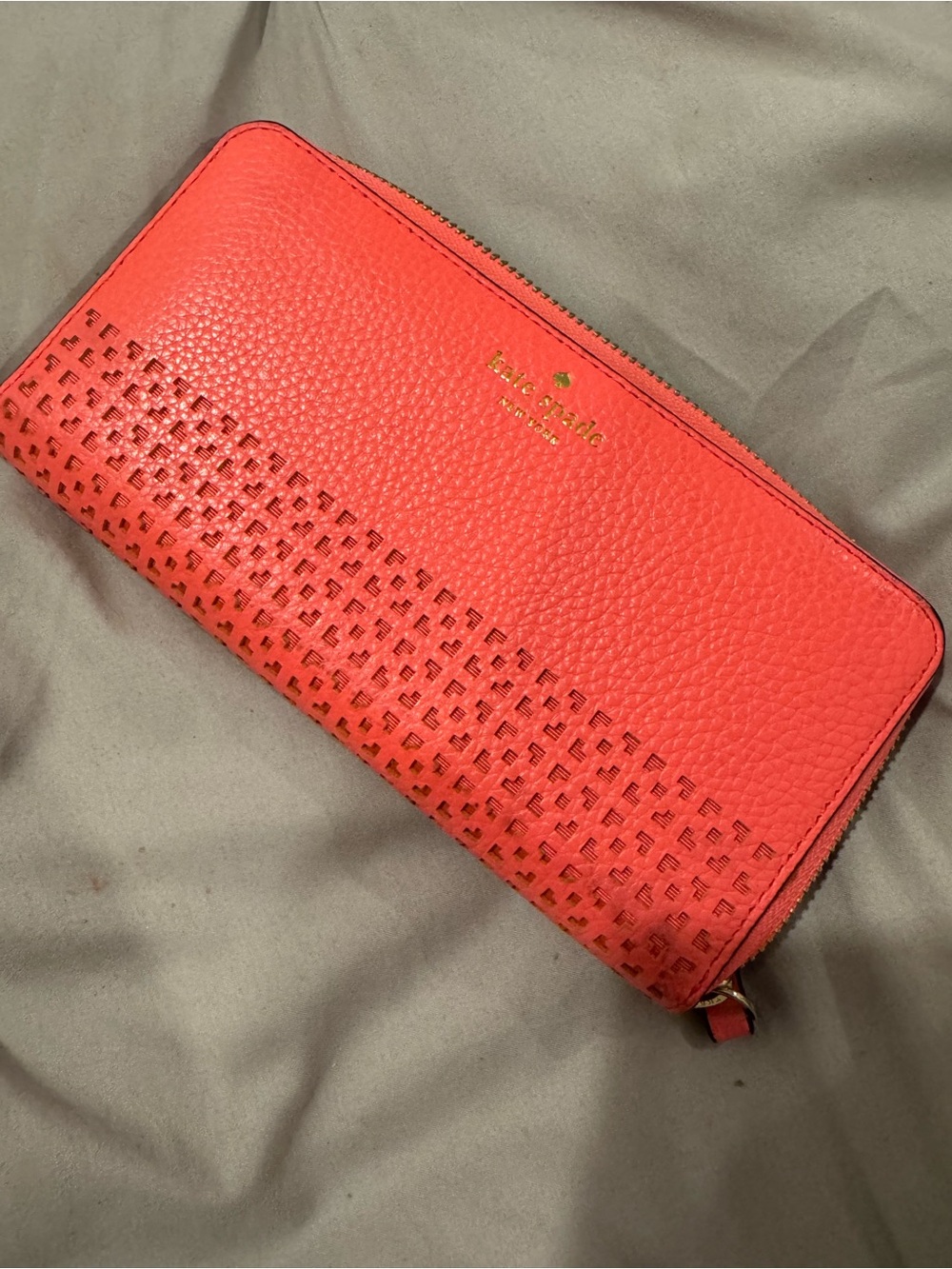 kate spade coral perforated pebble leather zip wallet